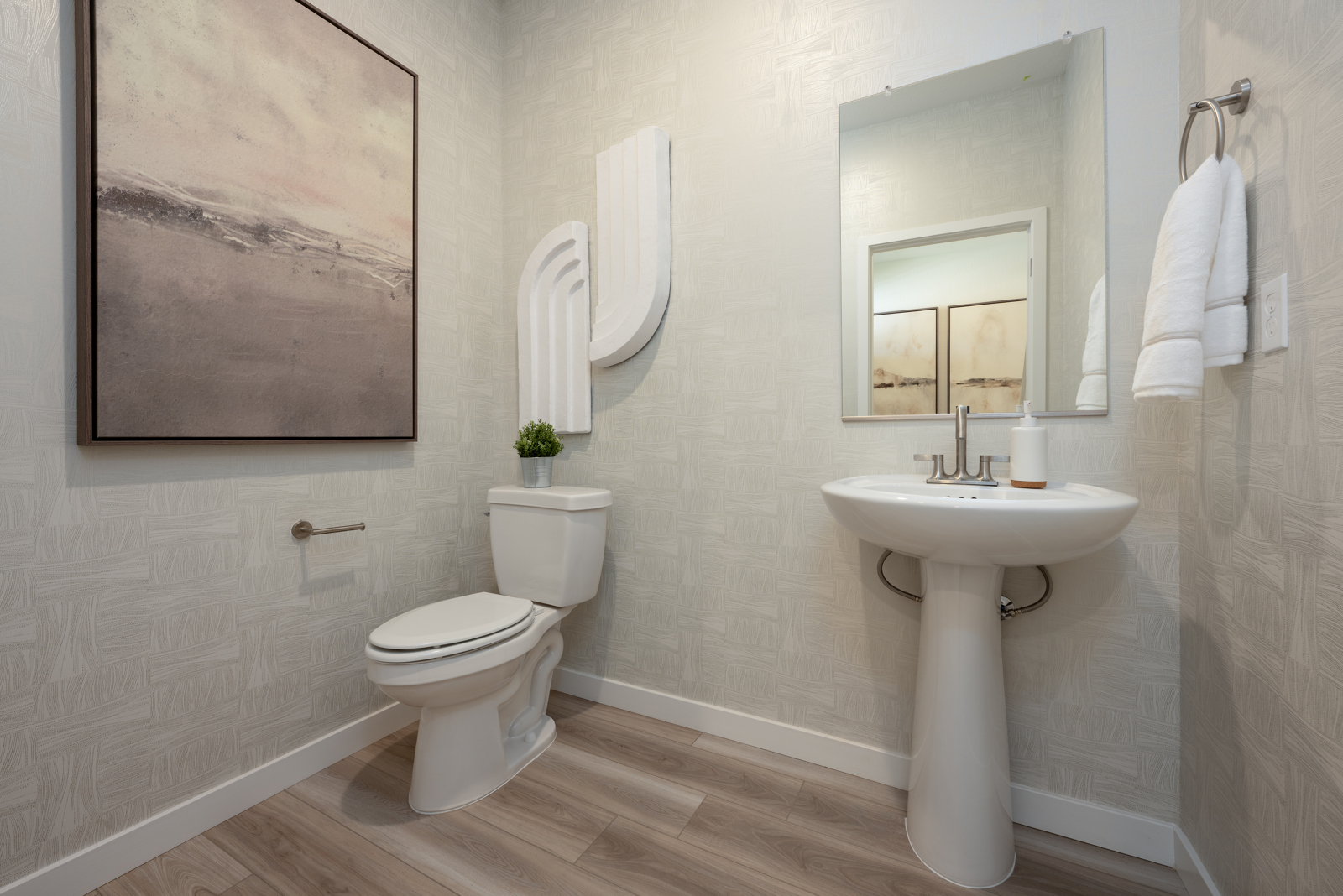 A bathroom with a toilet and sink.