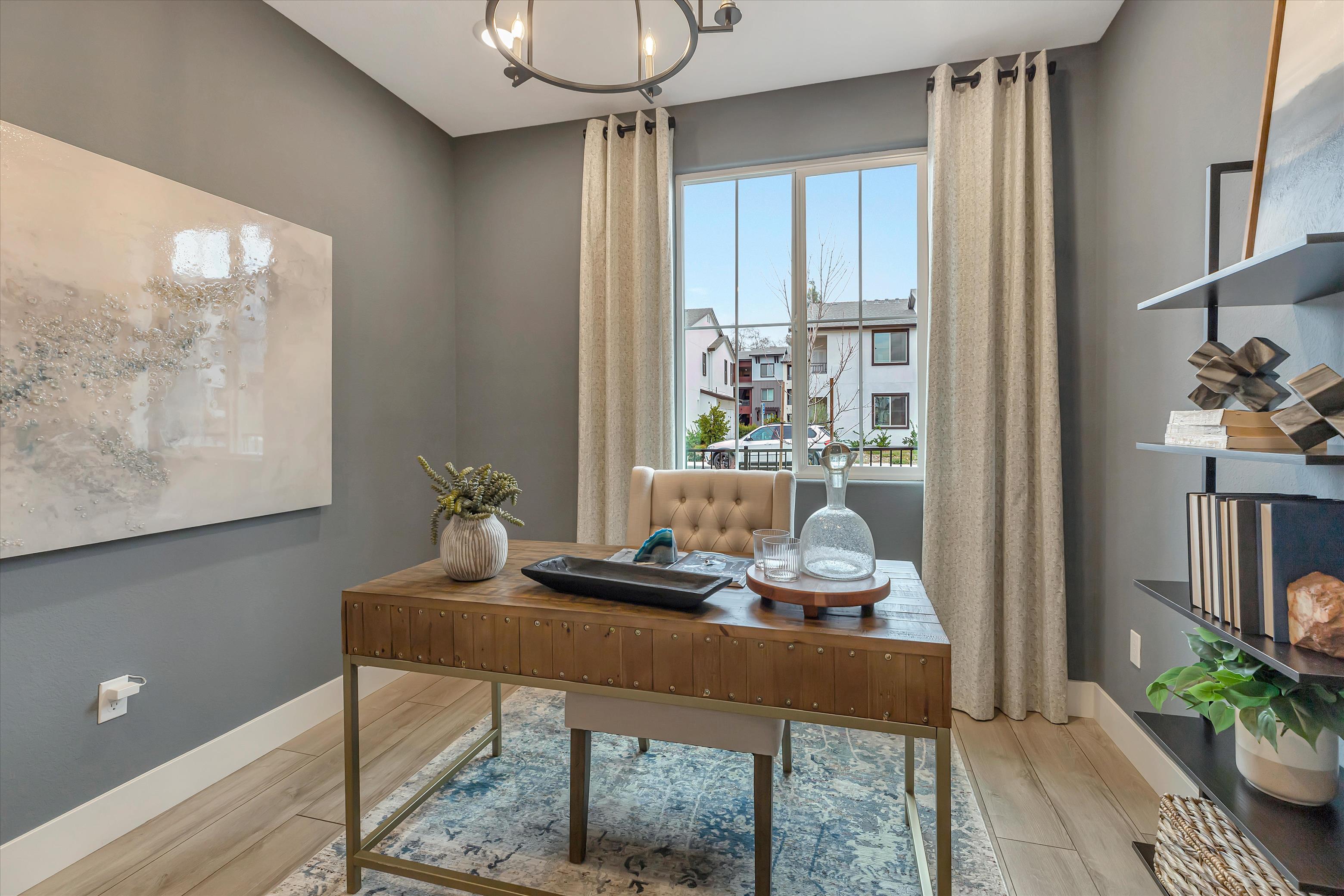 A room with a table and chairs.