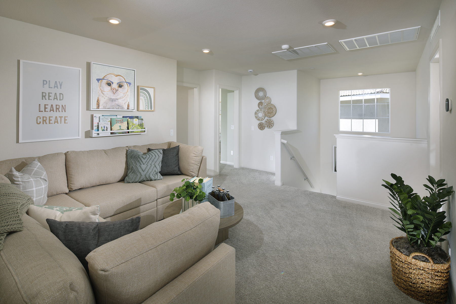 A living room with a couch and a rug.