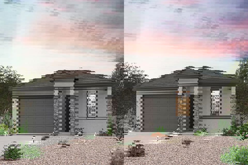 A house with a gravel driveway.