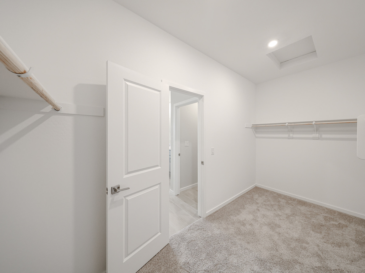 A hallway with white doors.