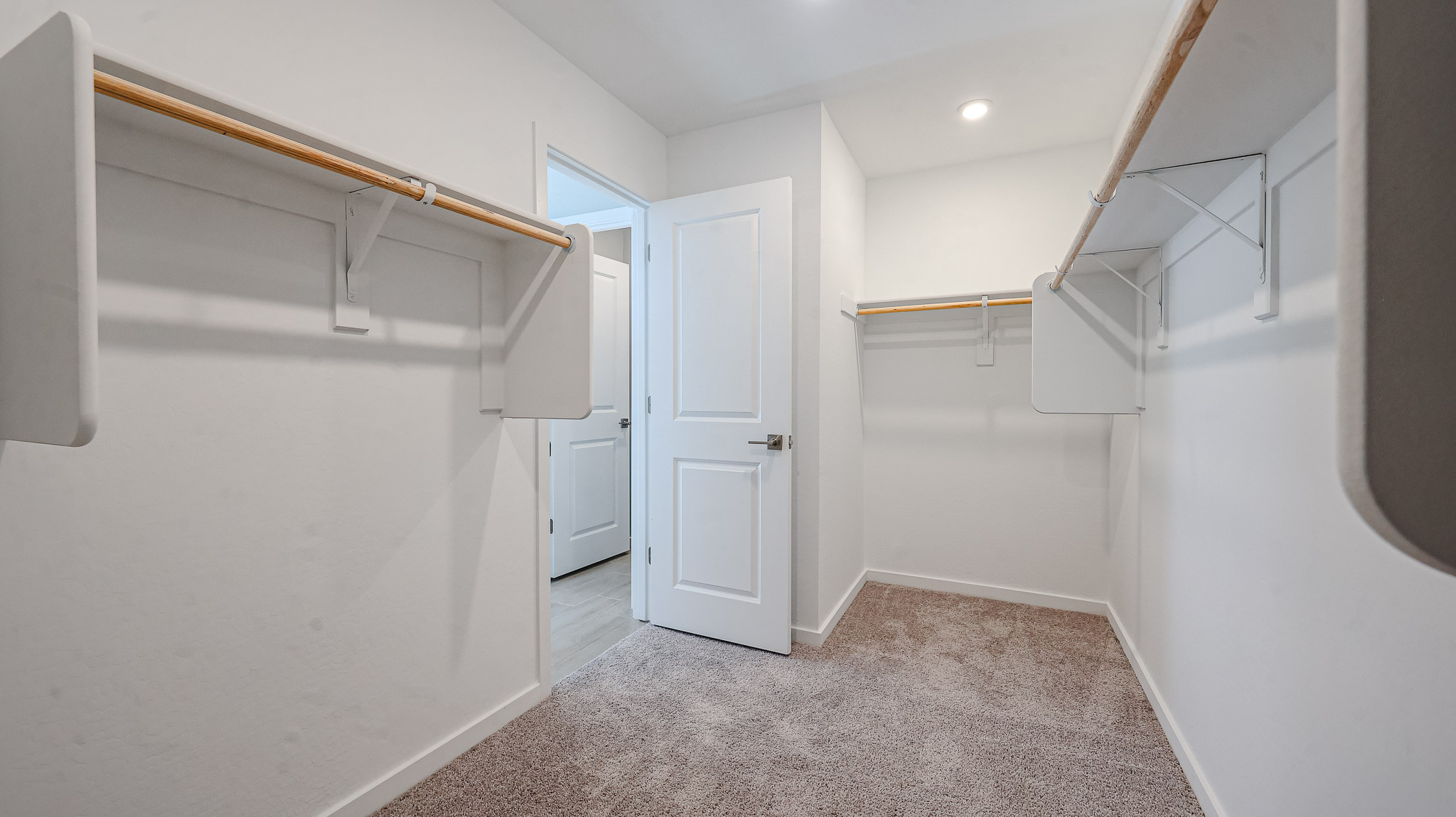 A hallway with white walls.