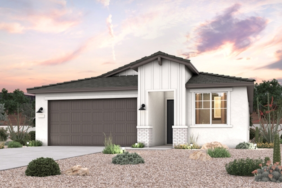 A house with a gravel driveway.