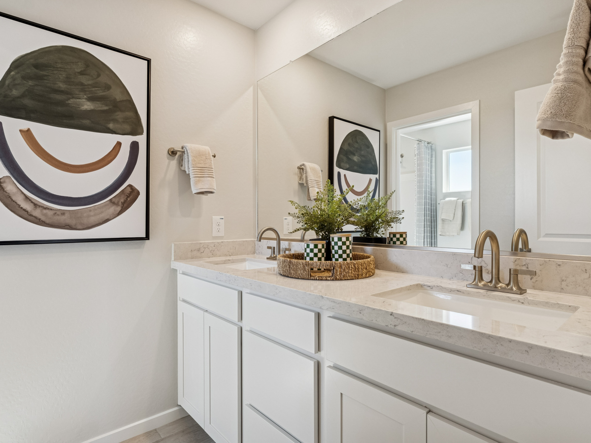 A bathroom with a large mirror.