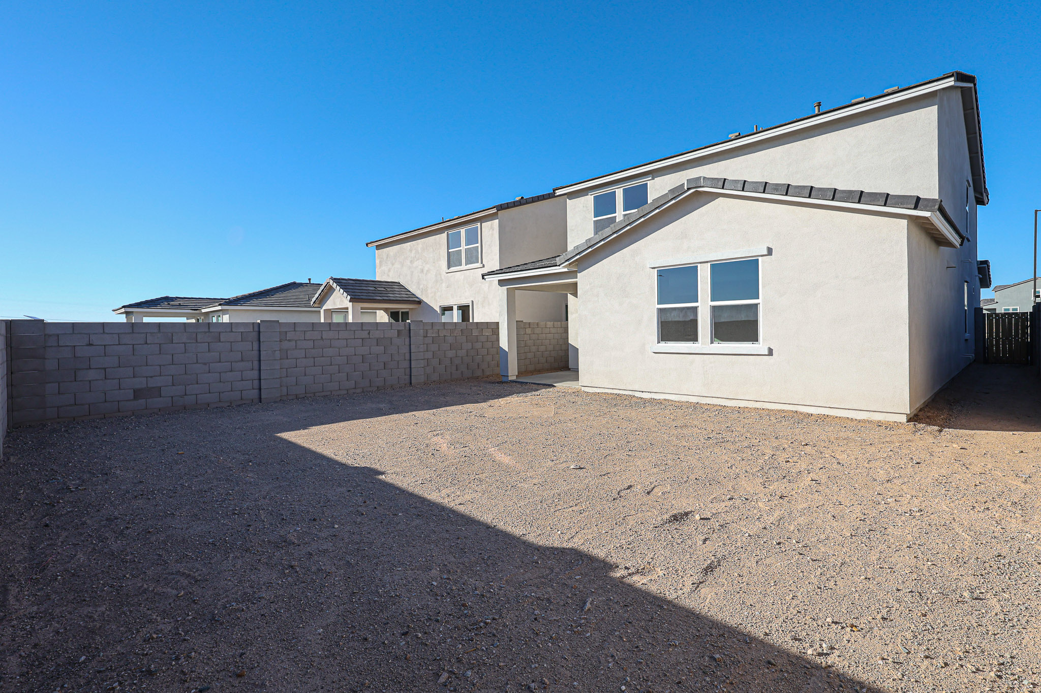 A building with a dirt lot.