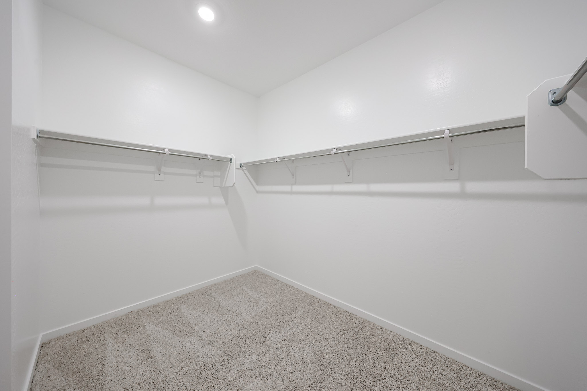 A white wall with a light on it.