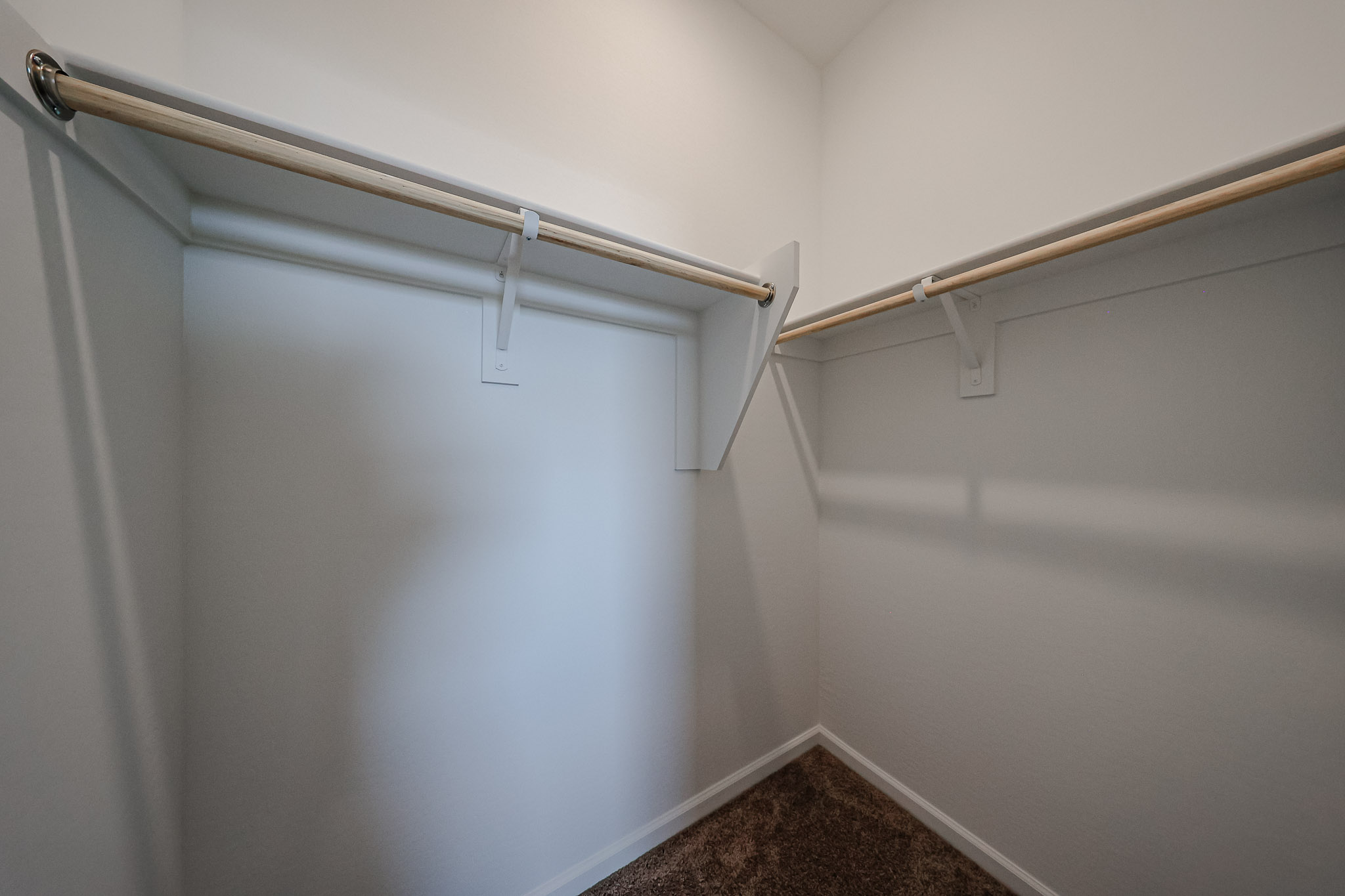 A metal bar on a white wall.