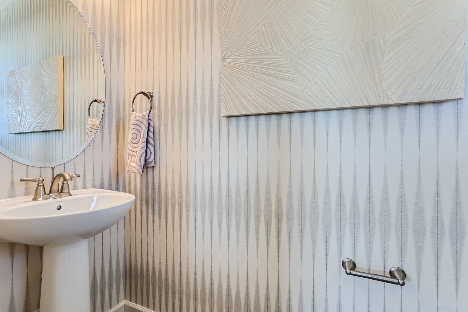 A bathroom with a mirror and sink.