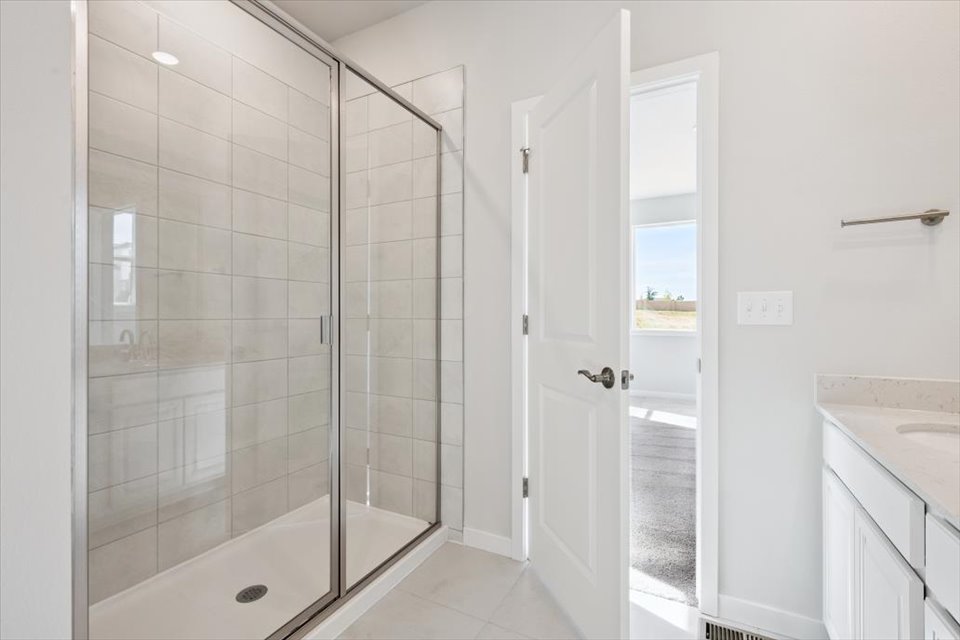 A bathroom with a glass shower.