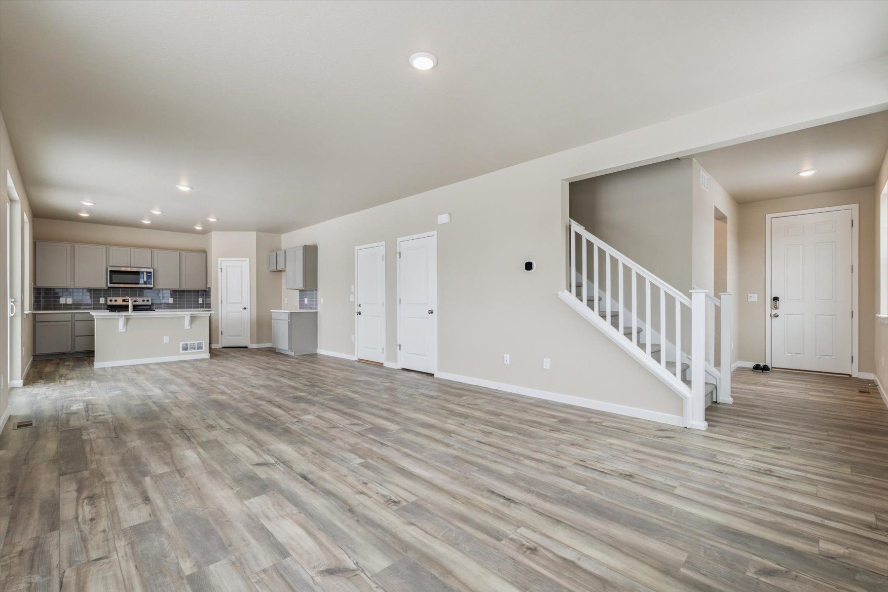 A large empty room with white walls.