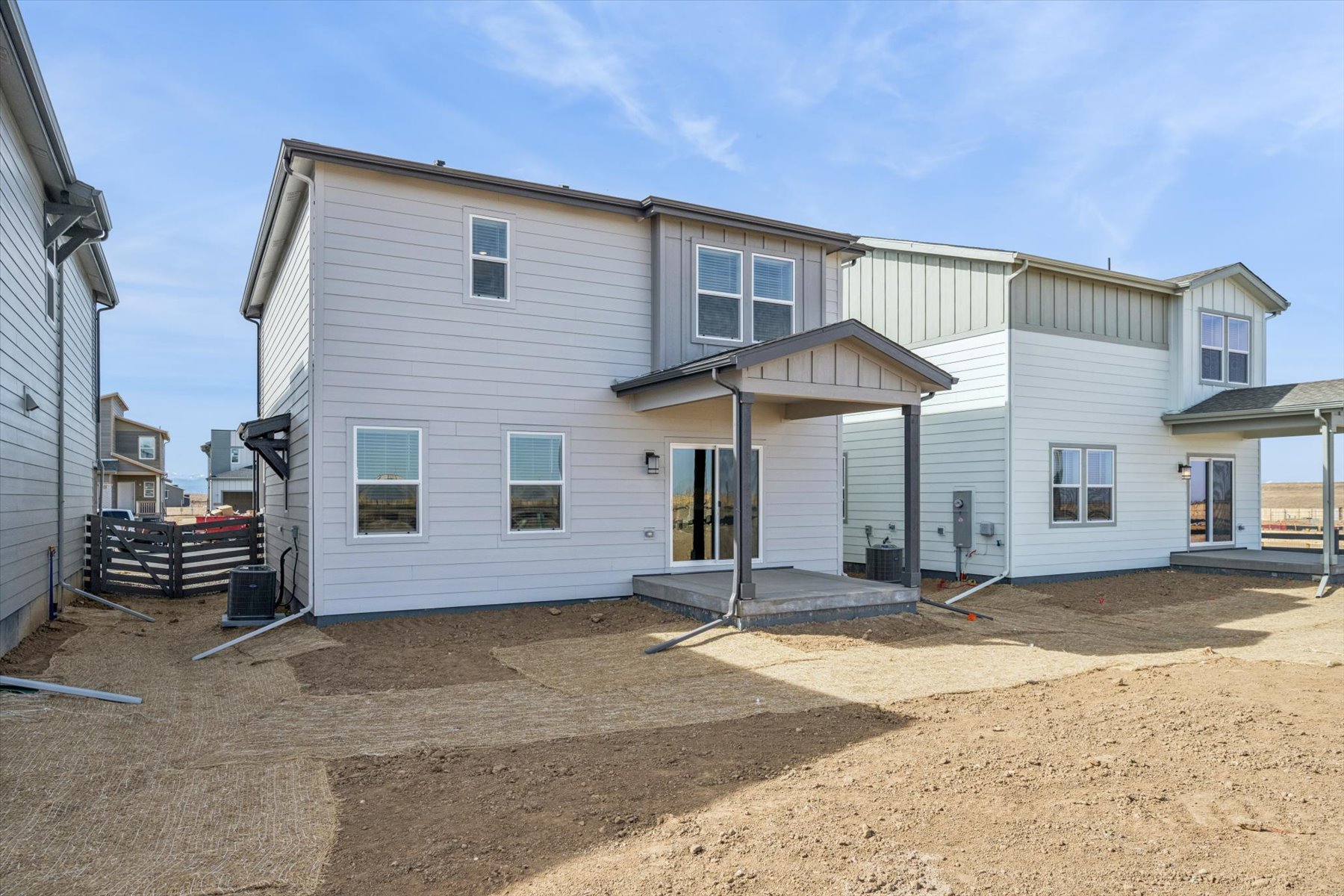 A white building with a garage.