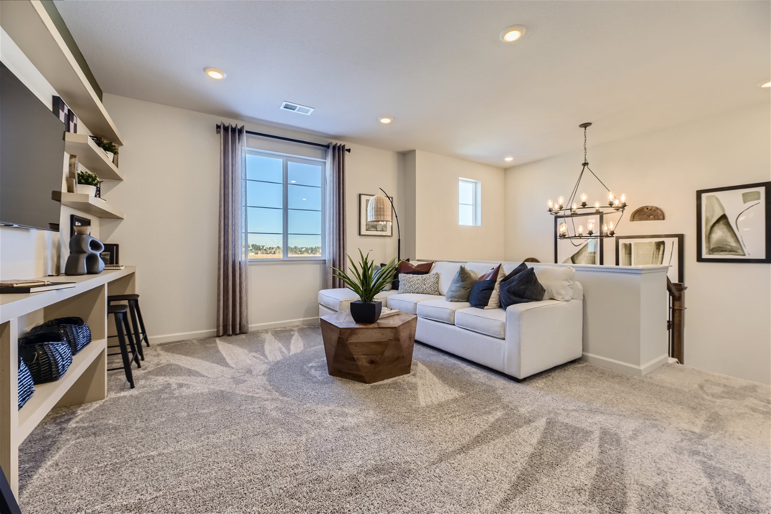 A living room with a couch and a table.