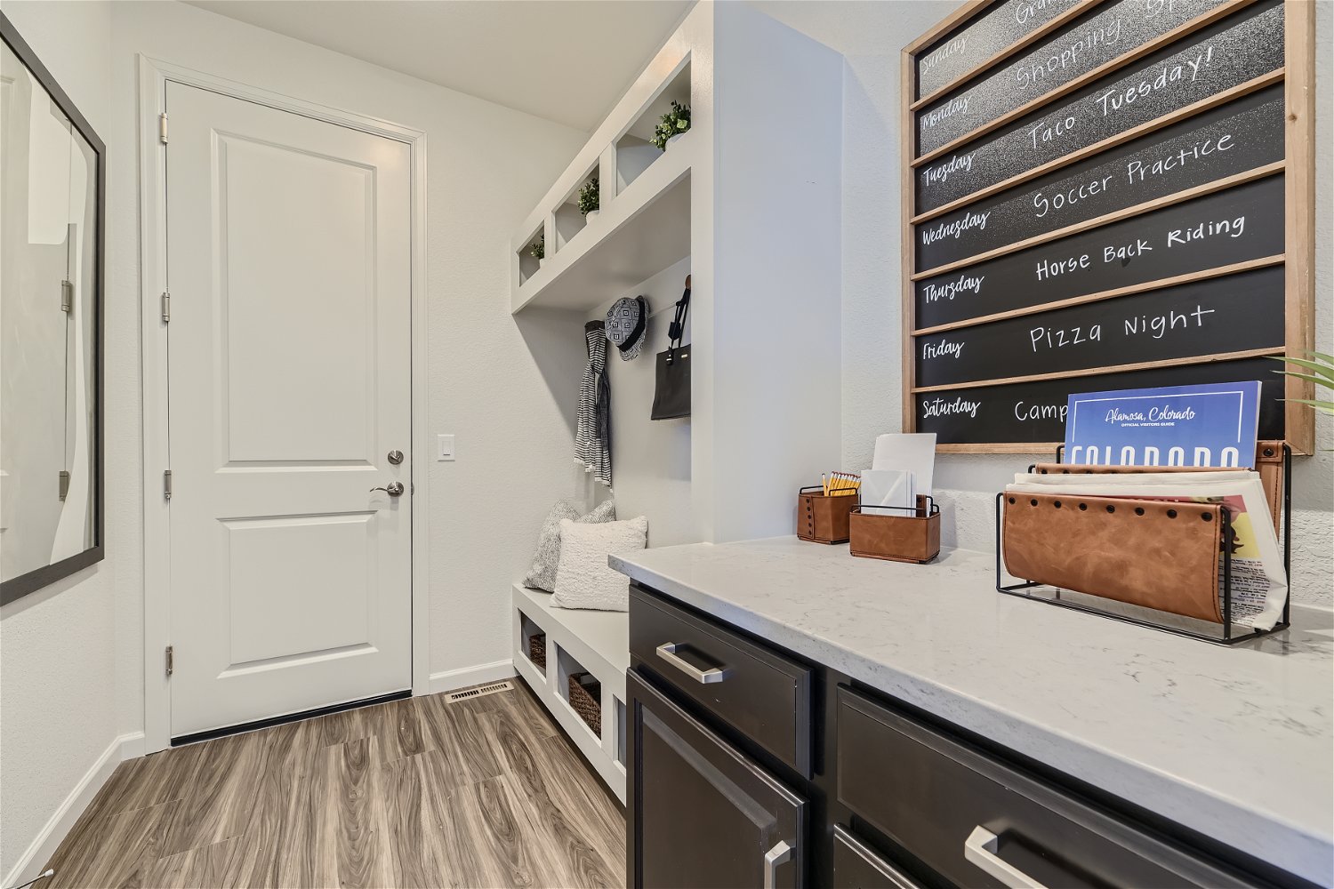 A kitchen with a counter top and a sink.