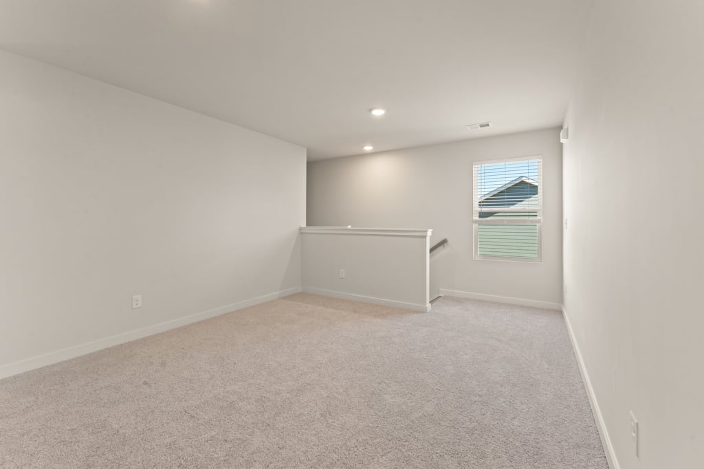 A room with a window and a door.