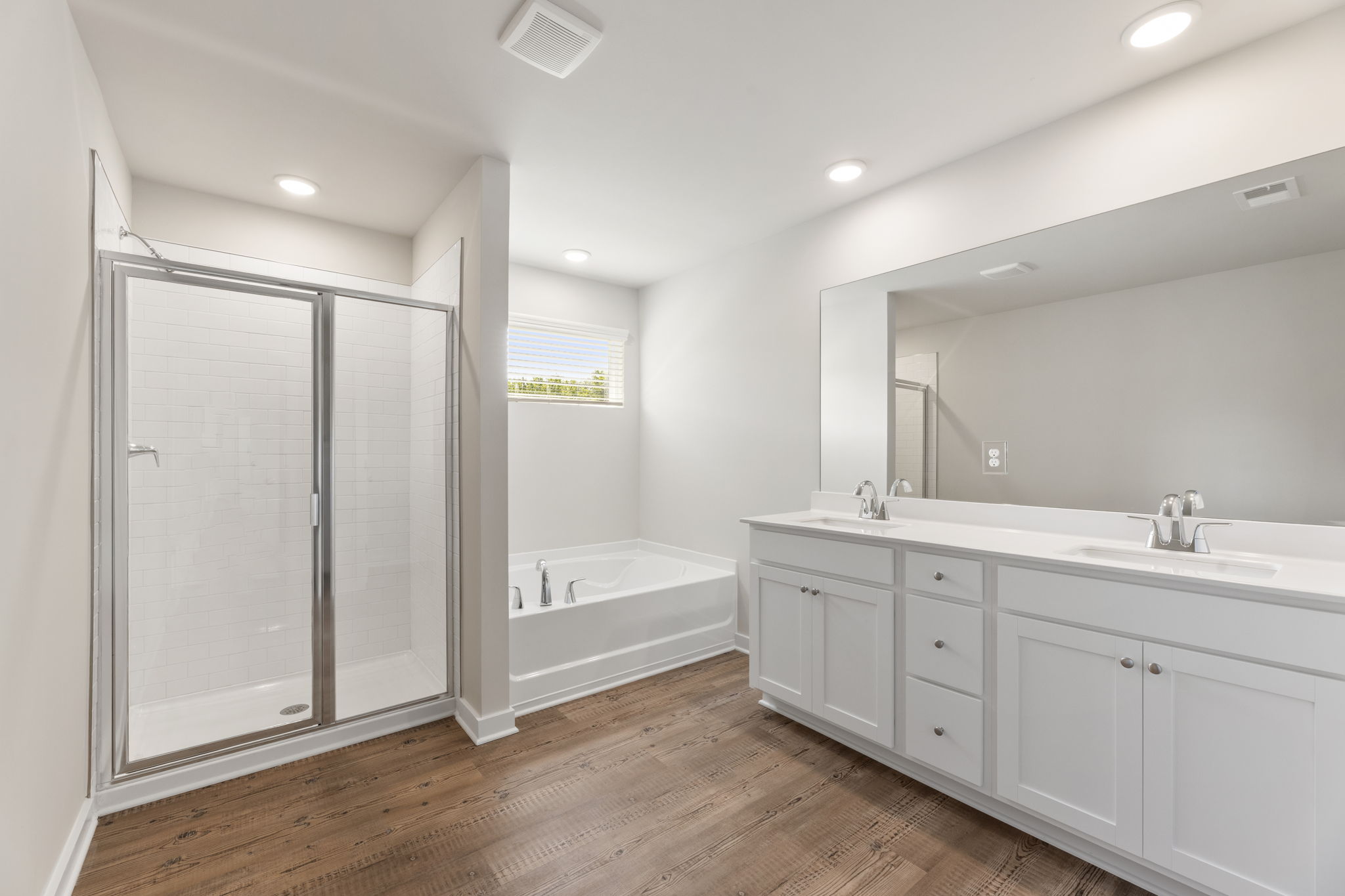 A bathroom with a tub and sink.