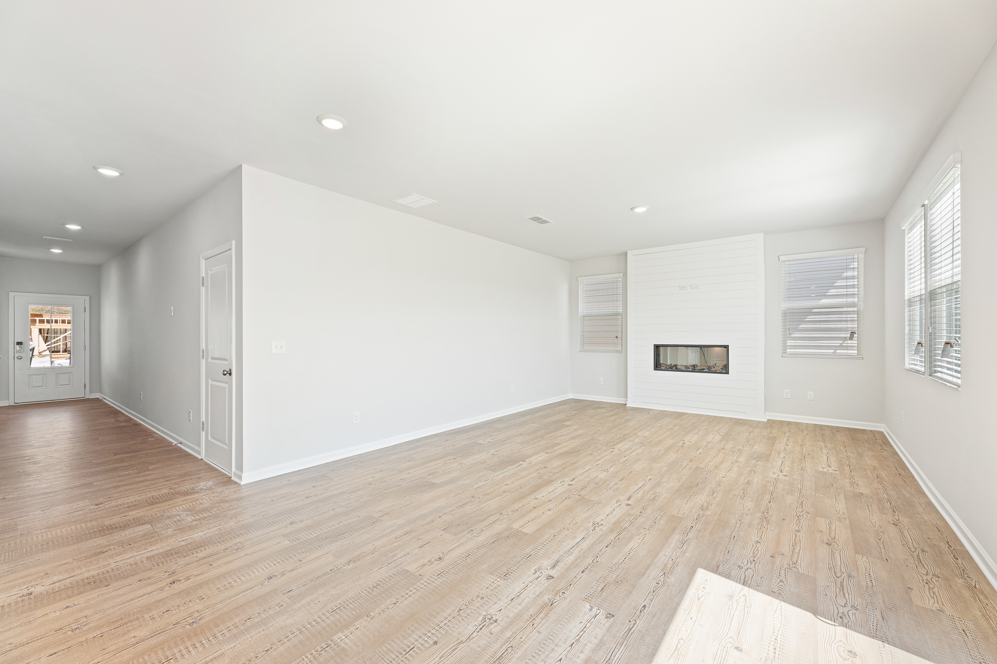 A room with a wood floor and a wood floor.