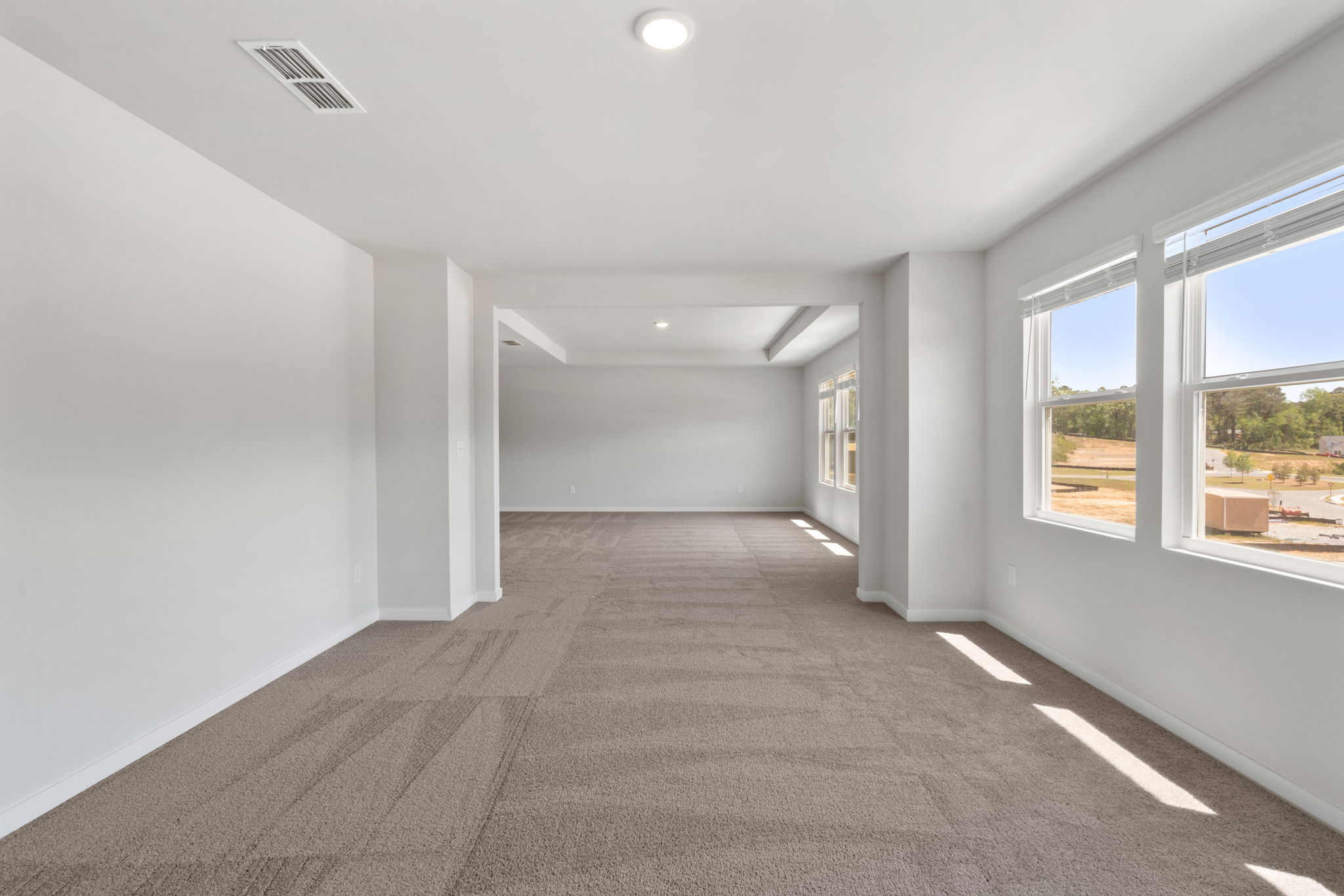 A long hallway with windows.
