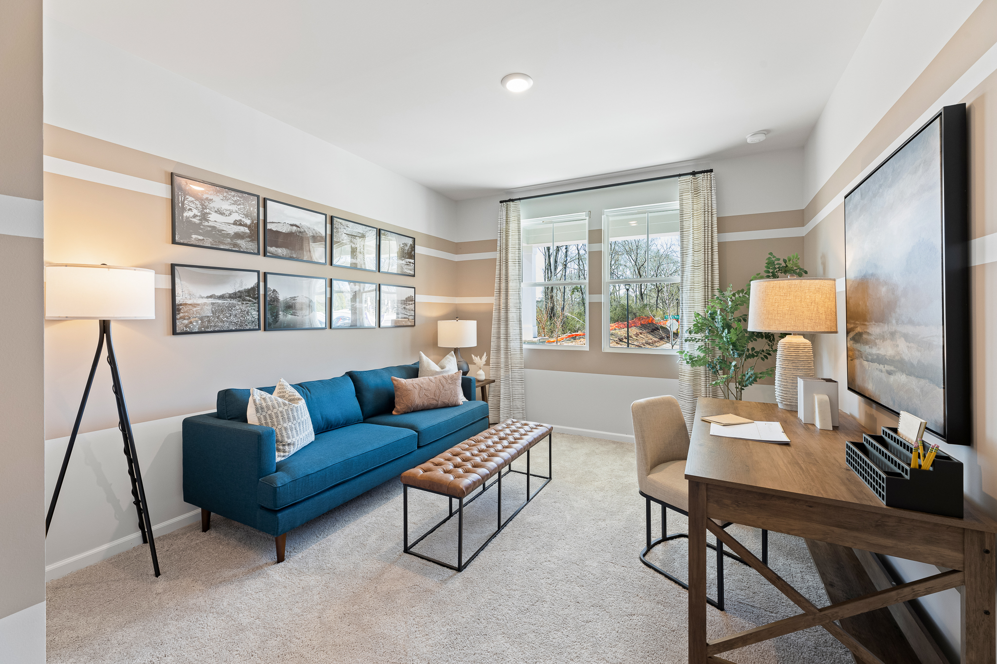 A living room with a blue couch.