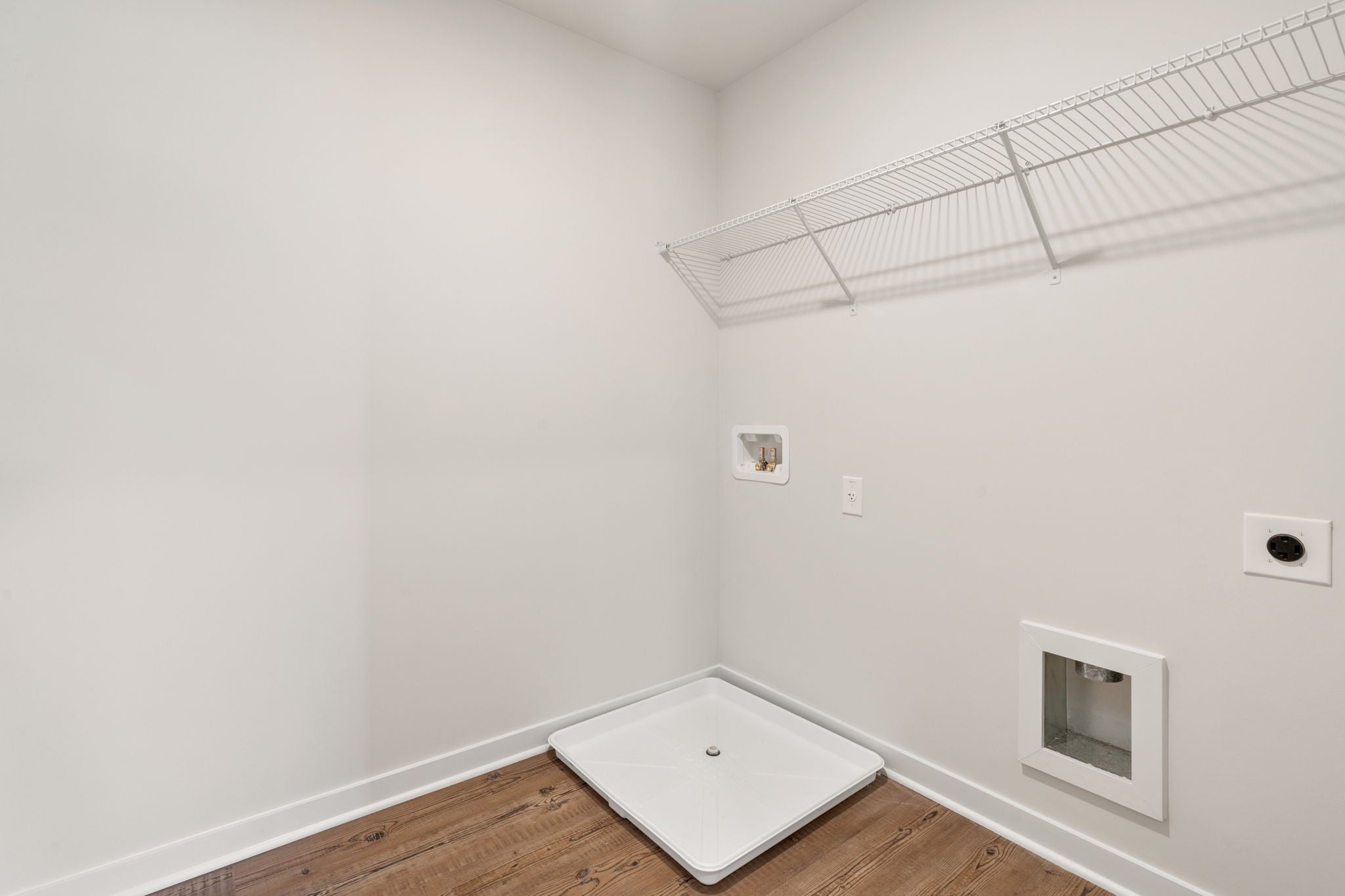 A white room with a white wall.