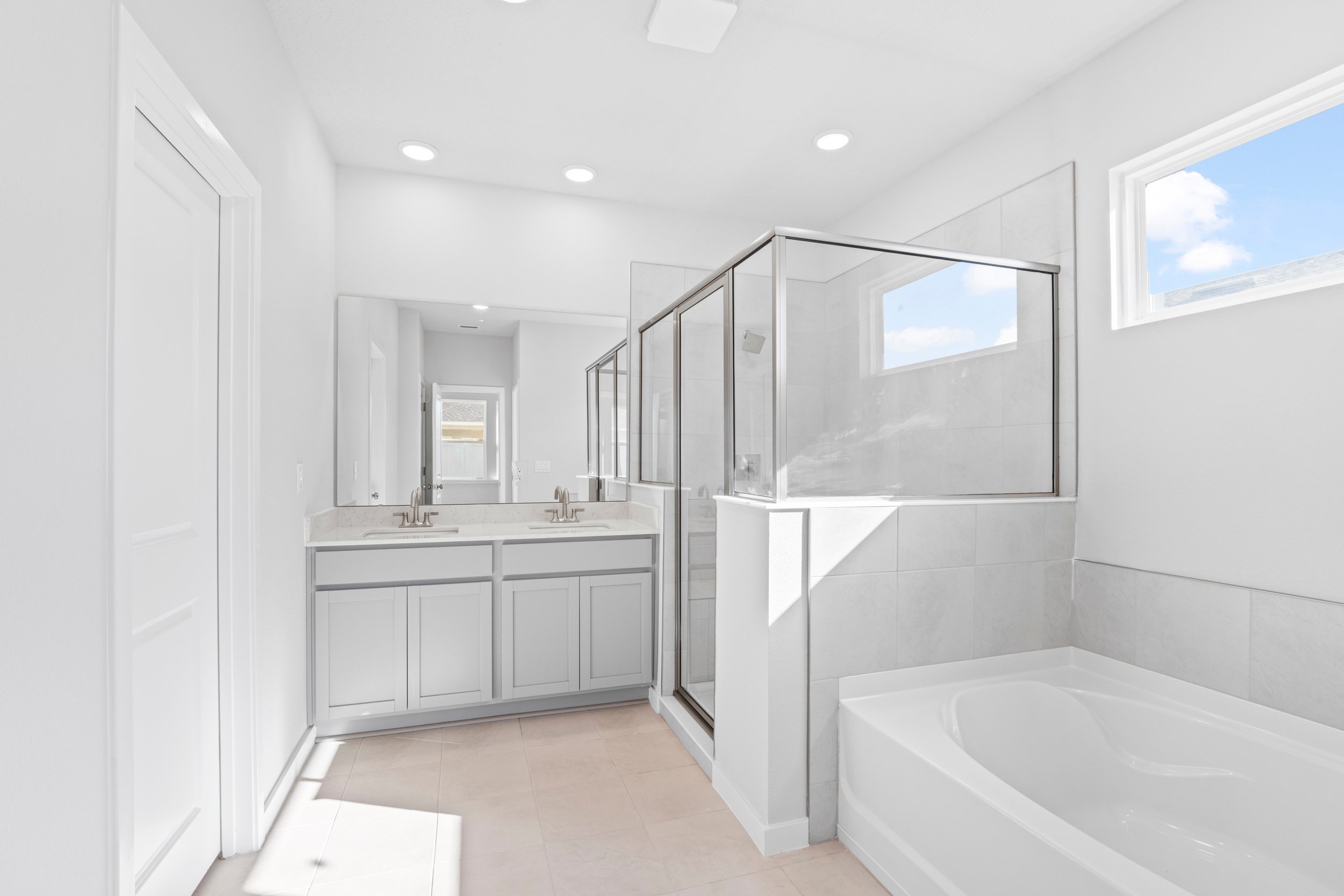 Lot 23 Primary Bathroom with Bathtub and Walk-In Shower at Camden Woods in Kingsland