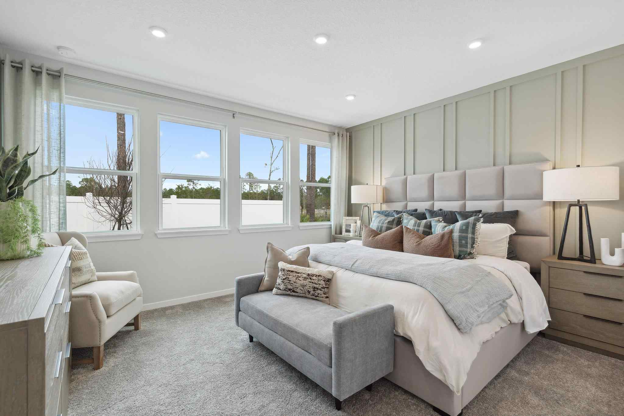 A living room with a couch and chairs.