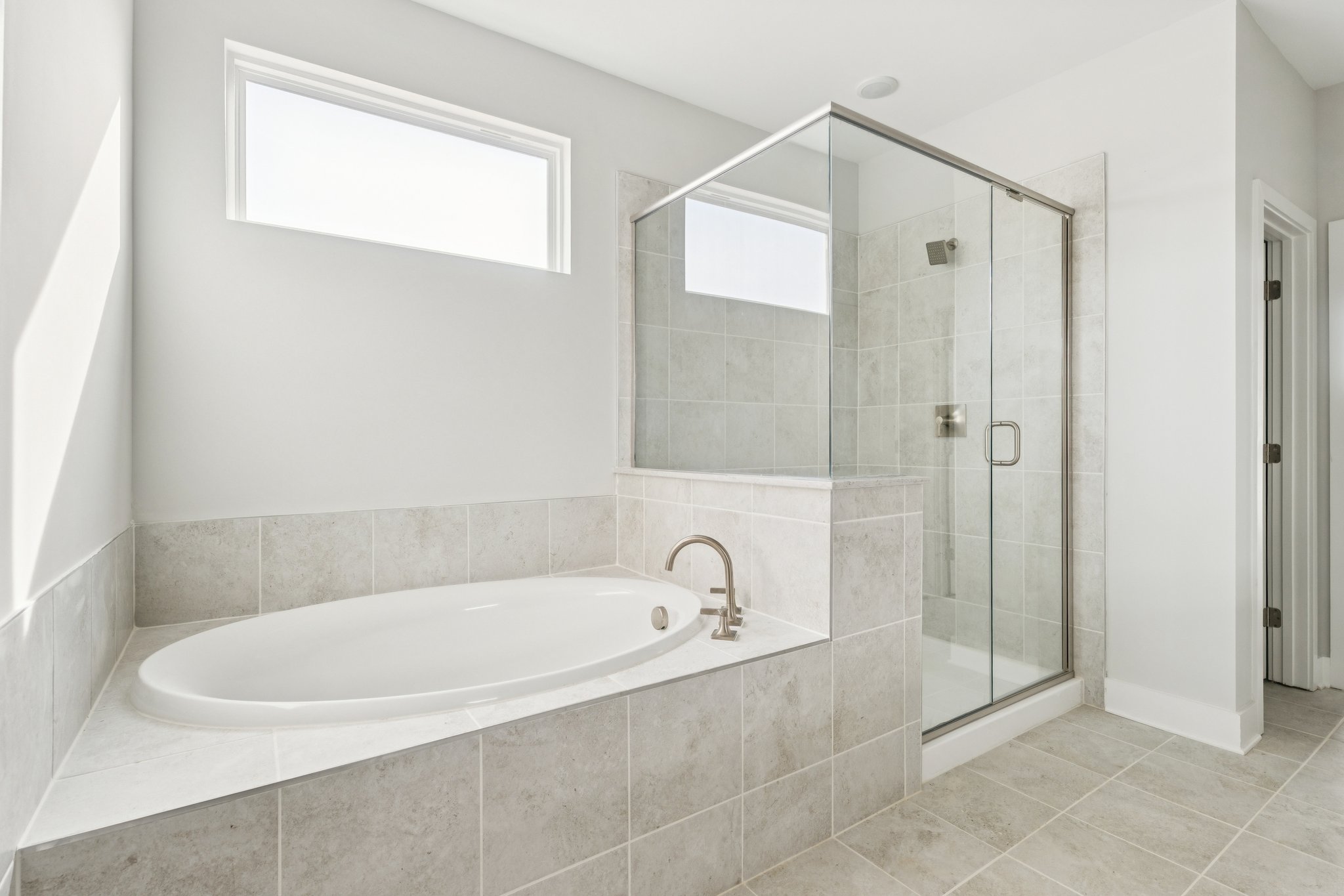 A bathroom with a glass shower.