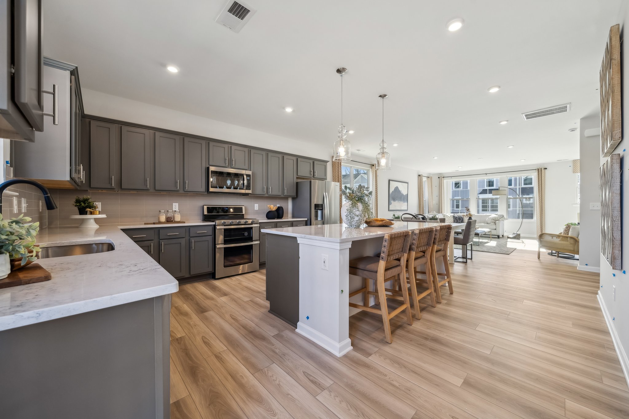 A kitchen with a wood floor.