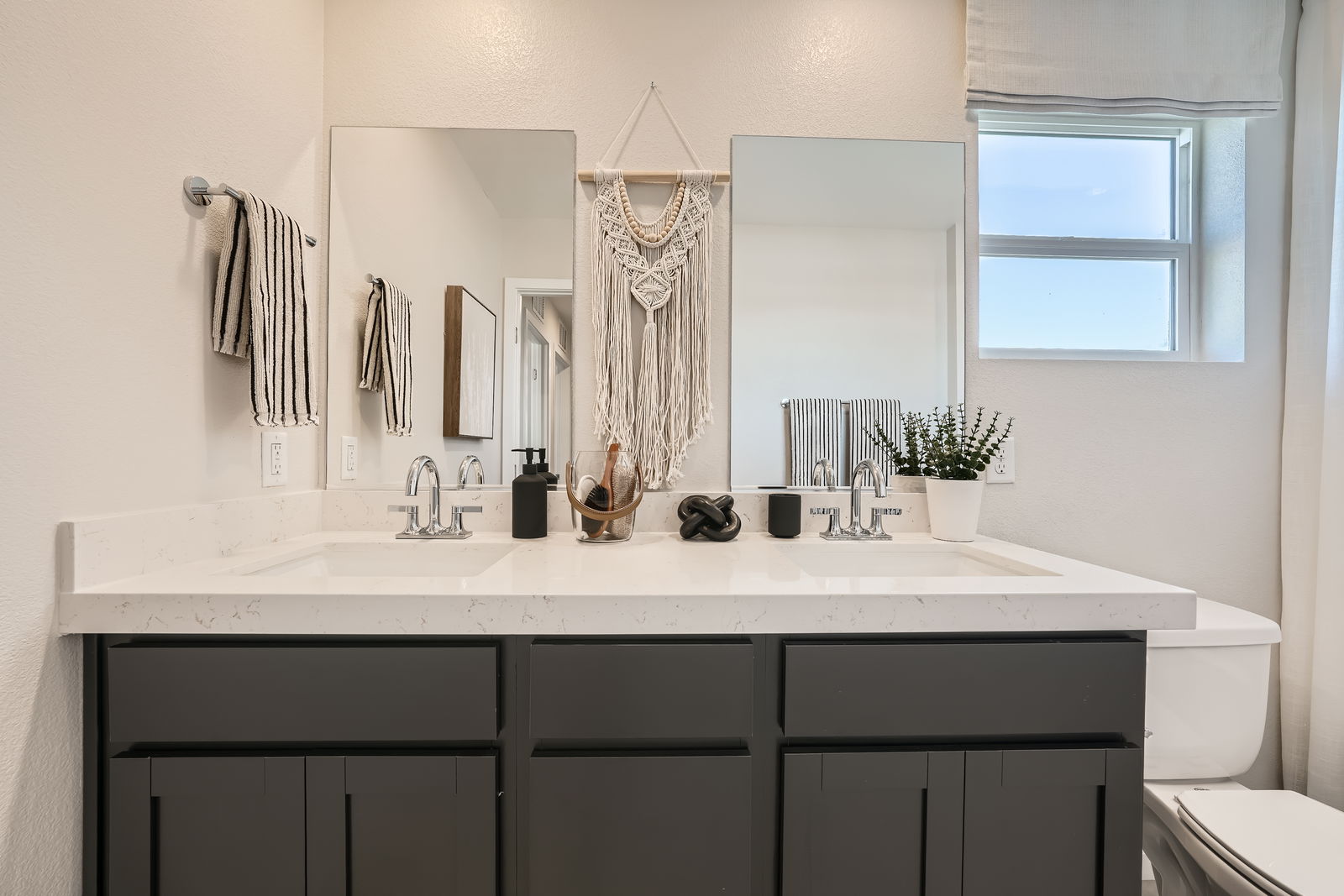 A bathroom with a sink and a toilet.