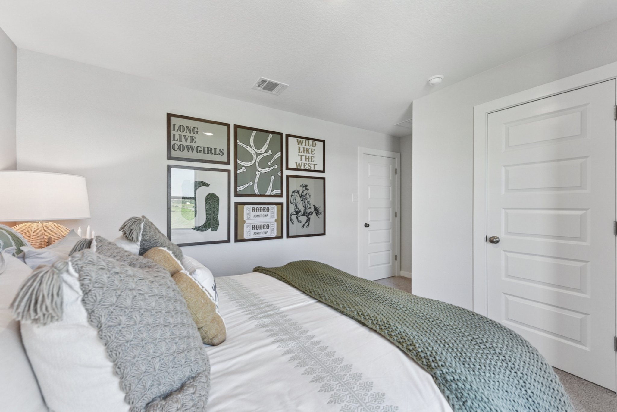 A bed with a white door.