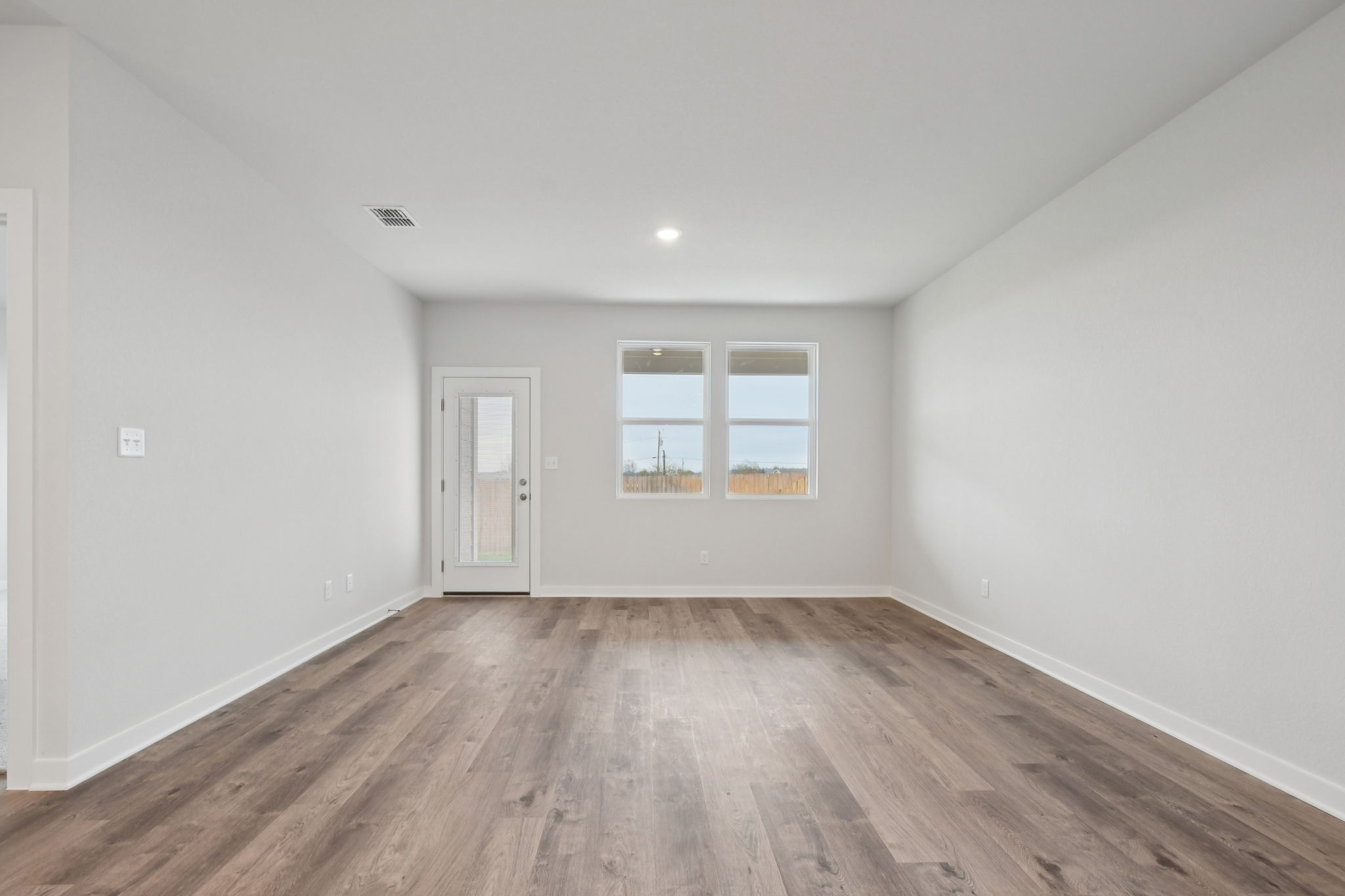 A room with a wood floor and a wood floor.