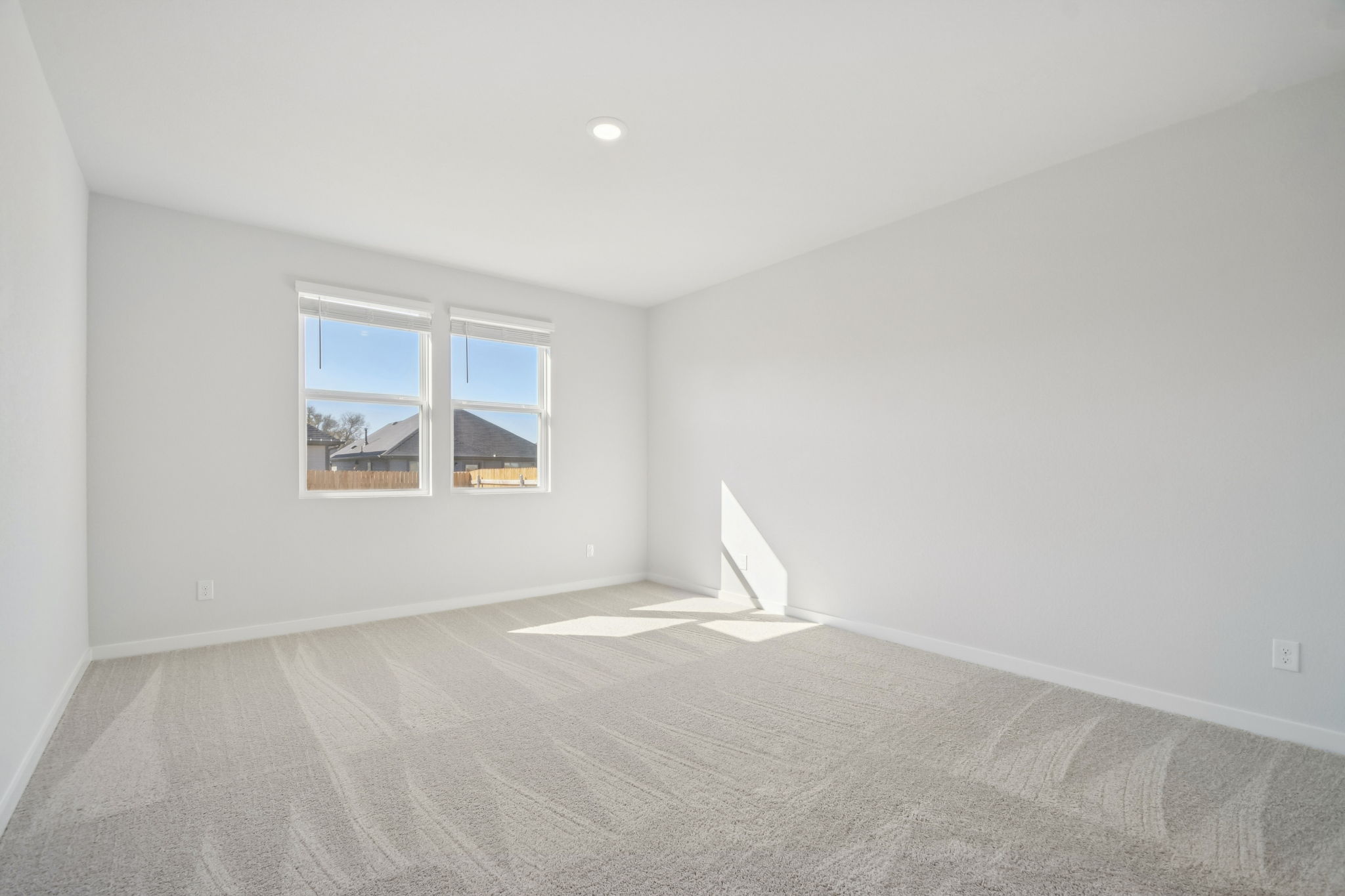 A room with a bed and a window.