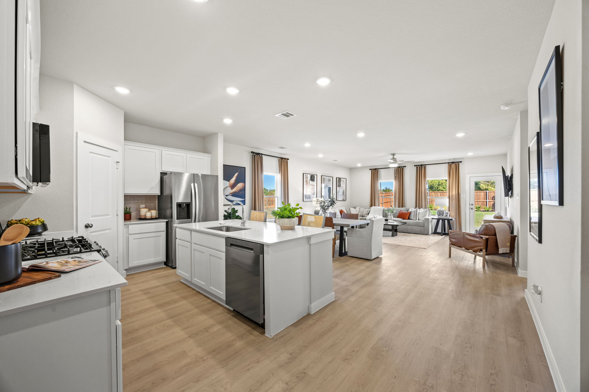 A kitchen with white cabinets.