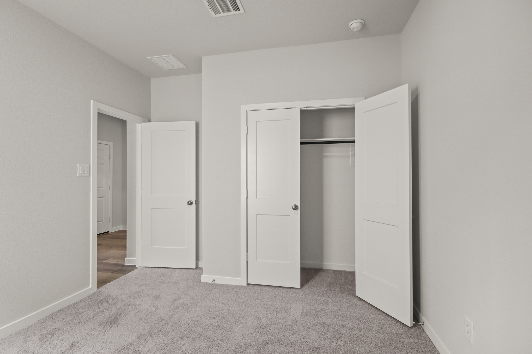 A room with white doors.