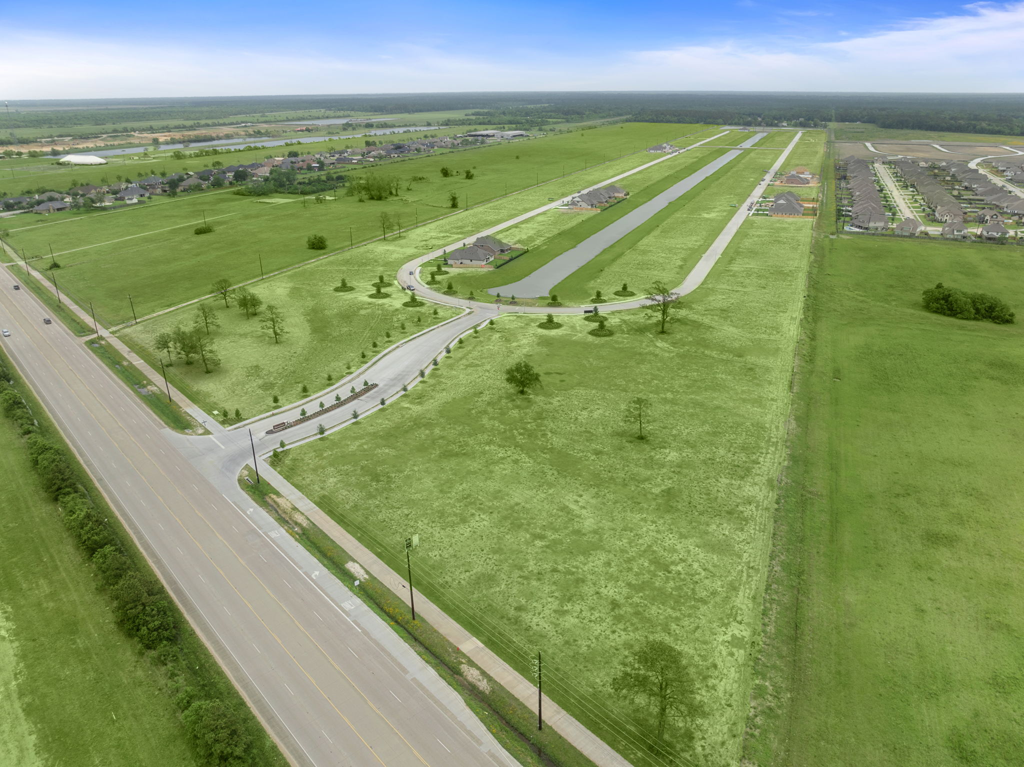 A road with grass and trees.