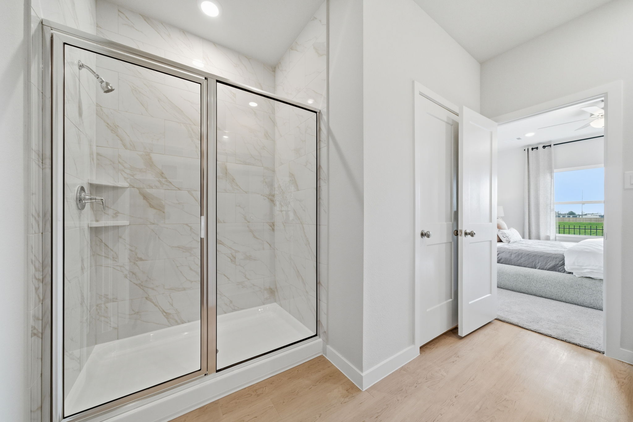A bathroom with a glass shower.