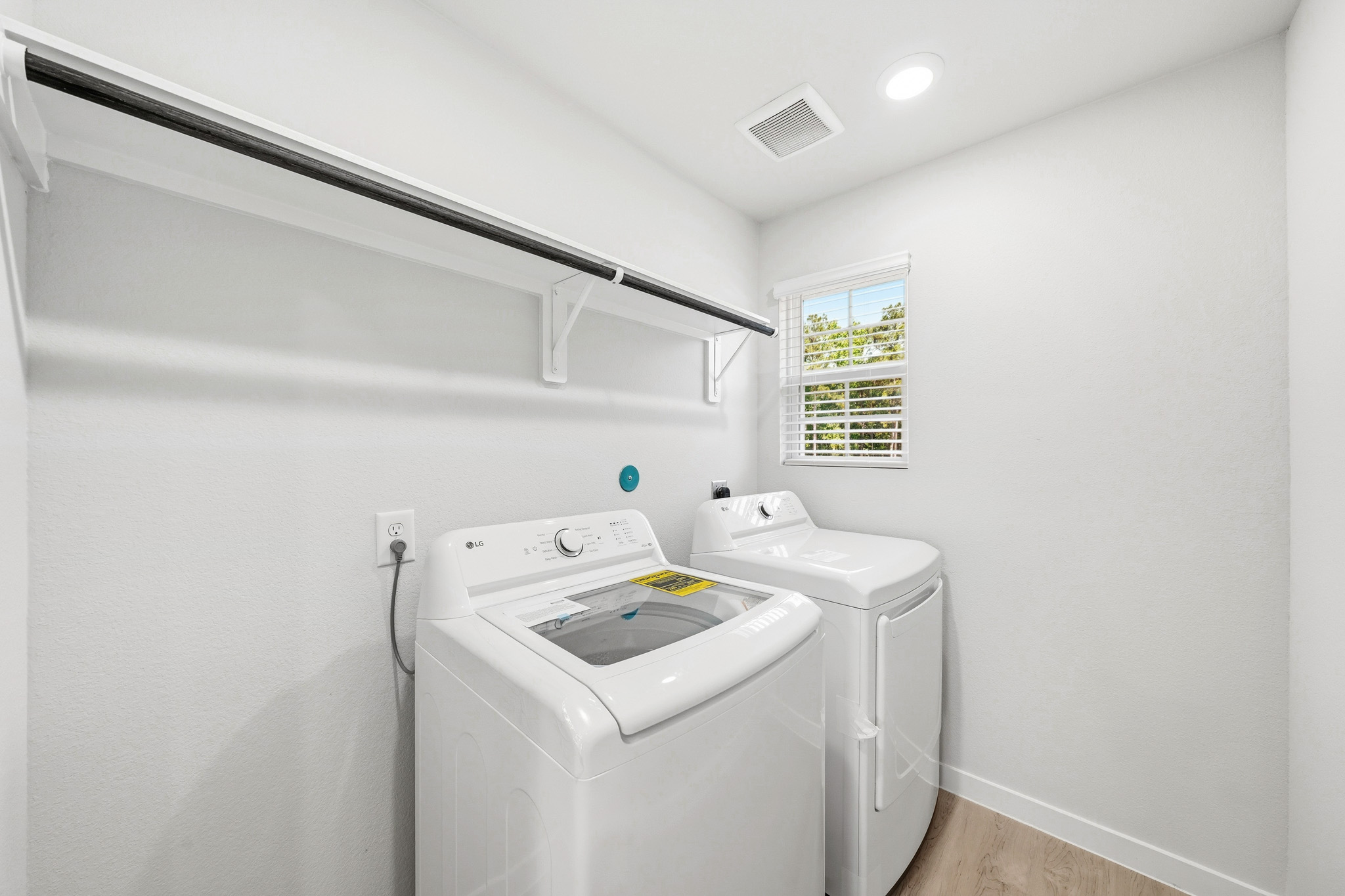 A washing machine in a room.