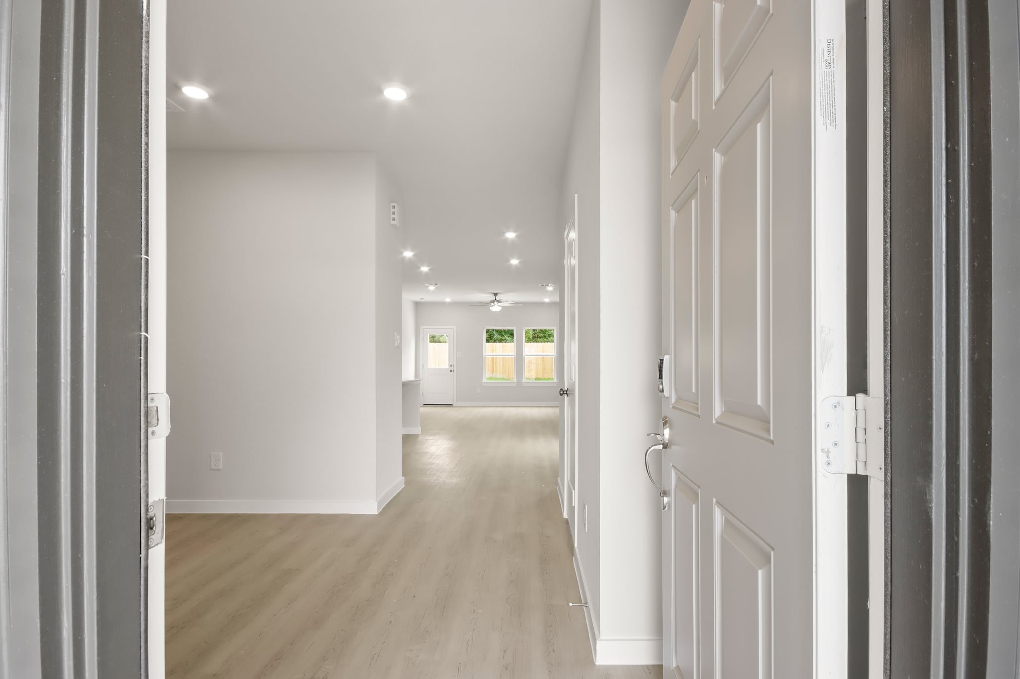 A hallway with white doors.