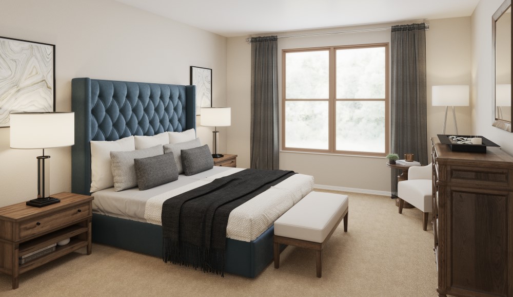 A bedroom with a bed and lamps.