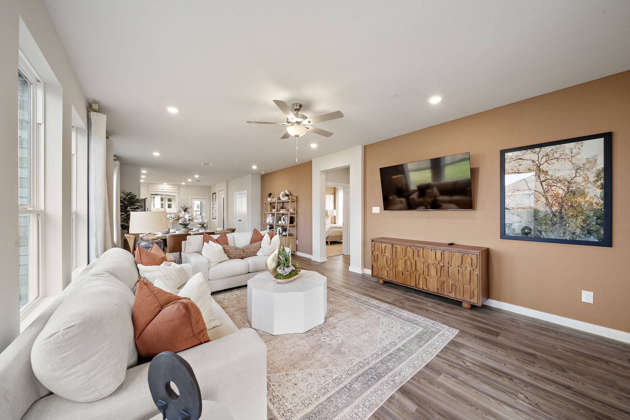 A living room with a couch and a table.