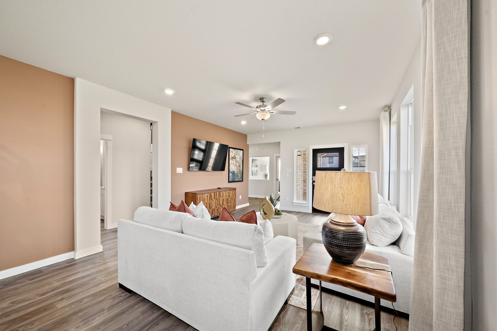 A living room with a white couch.