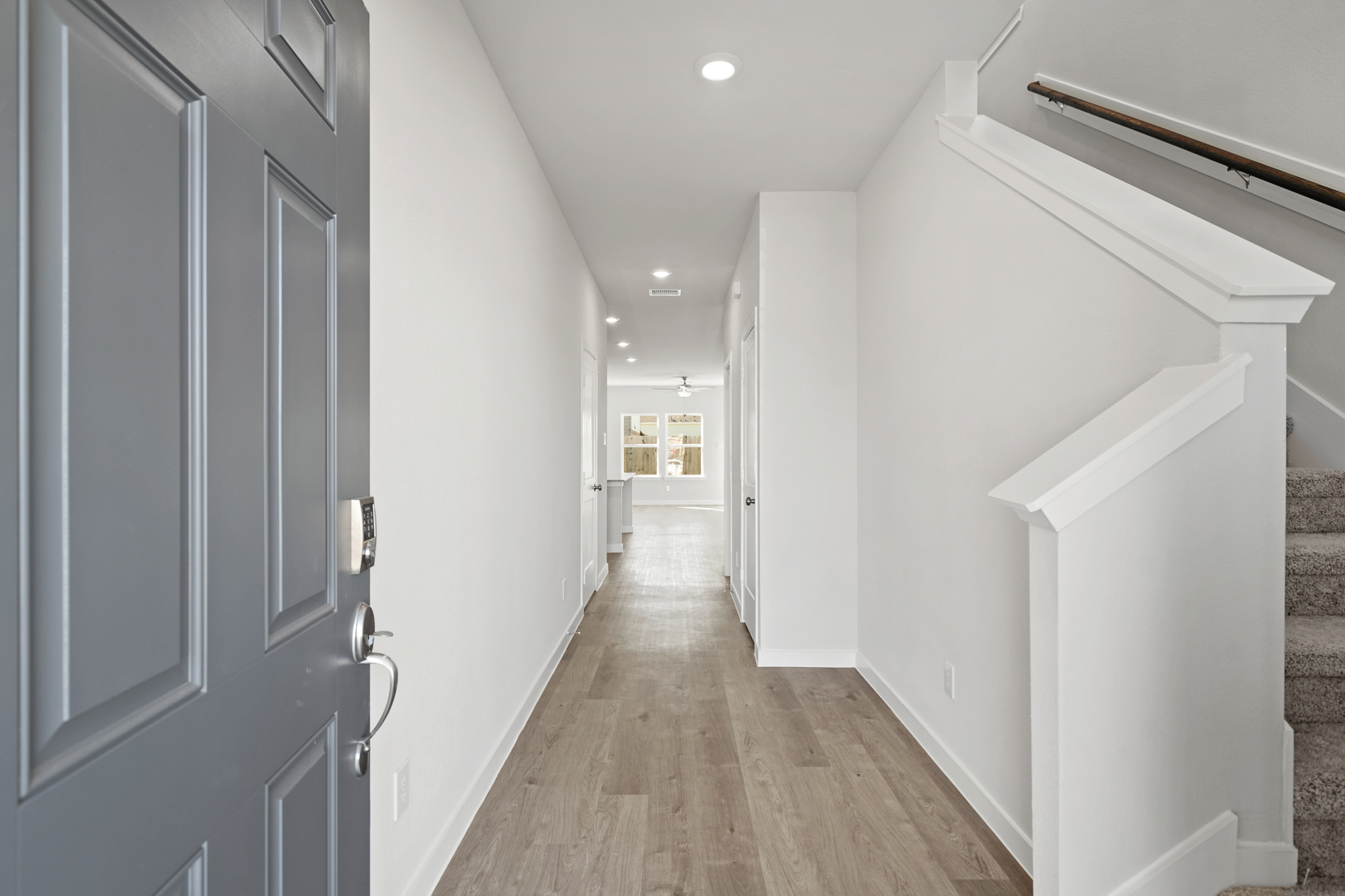 A hallway with white walls.