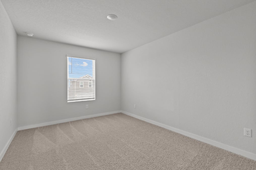A room with a white wall and a blue and white striped wall.