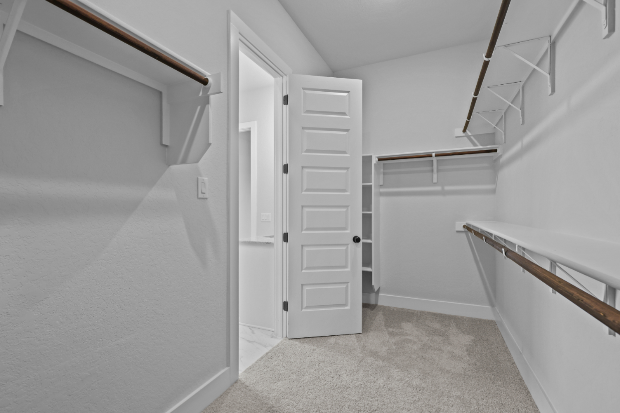 A hallway with white walls.