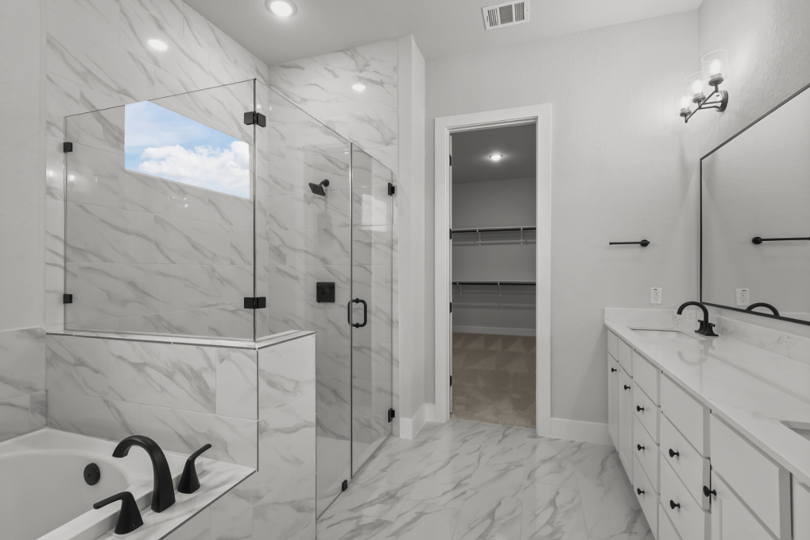 A bathroom with a glass shower.