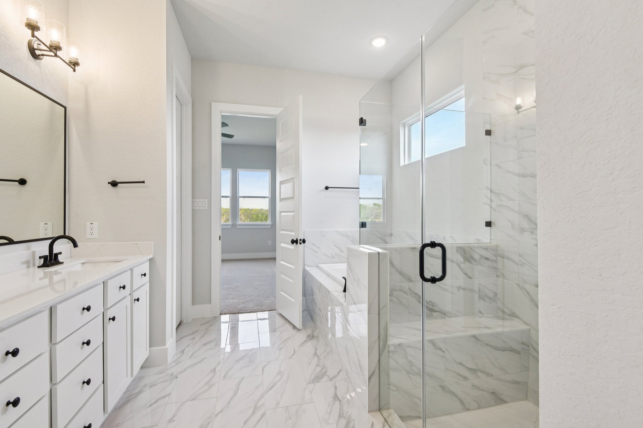 A bathroom with a glass shower.