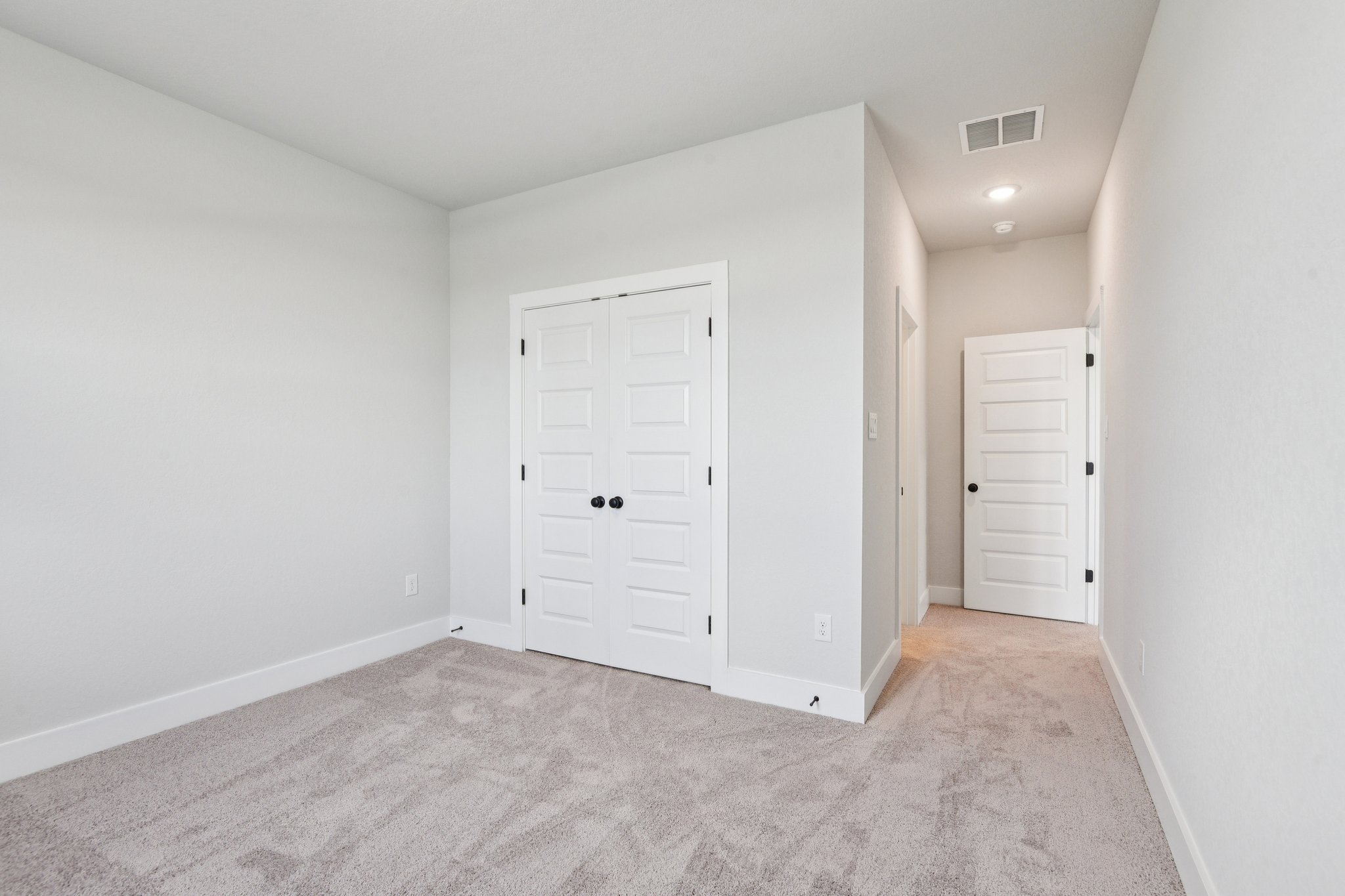 A room with white doors.