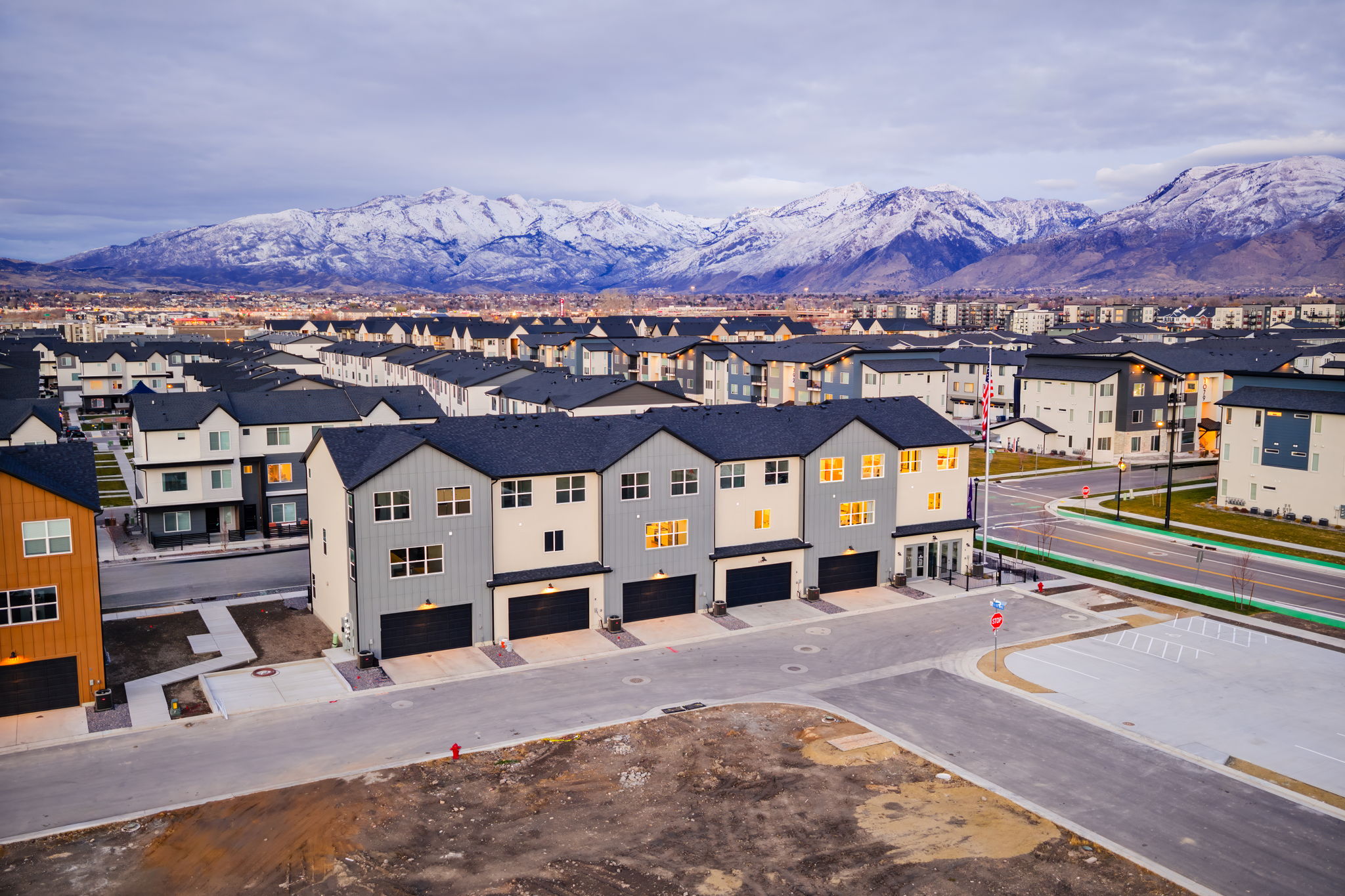 A group of buildings with mountains in the background.