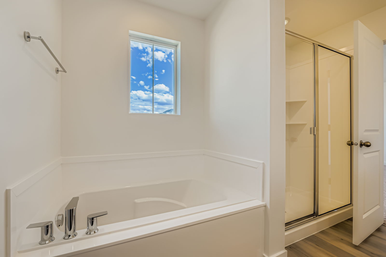 A bathroom with a tub and sink.