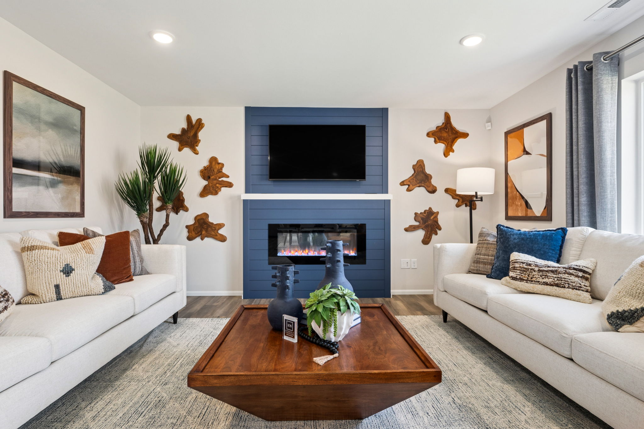 A living room with a fireplace.