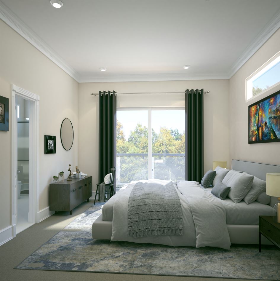 A bedroom with a large window.